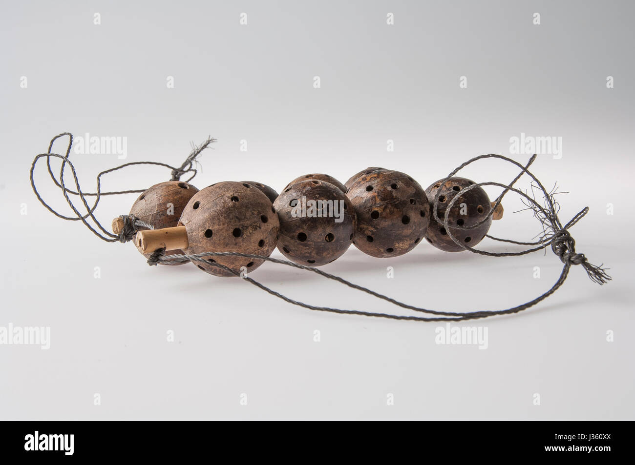 African handmade instrument, rattle isolated on white background Stock