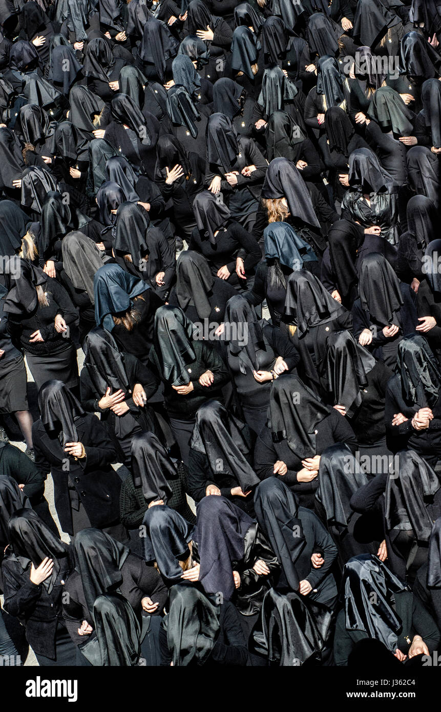 The flow of the women in black with the face covered by a black veil ...