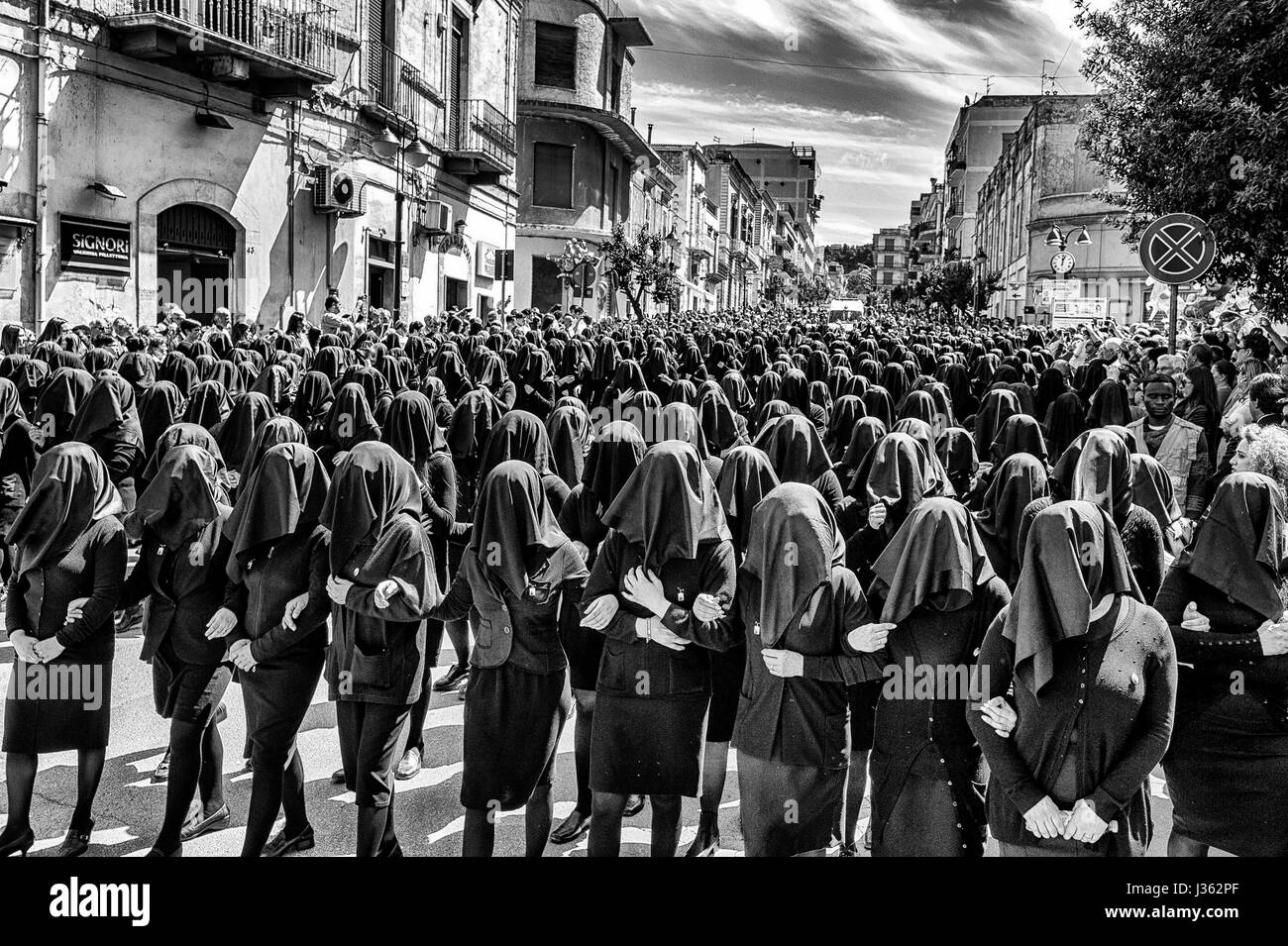 The women dressed in black parading along the streets of Canosa di Puglia village, Italy, during the procession of the Madonna Desolata Stock Photo