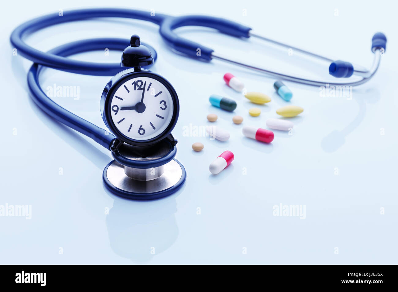 Time for health checkup with stethoscope and pills on blue background Stock Photo - Alamy Time for health checkup with stethoscope and pills on blue background Stock Photo - Alamy