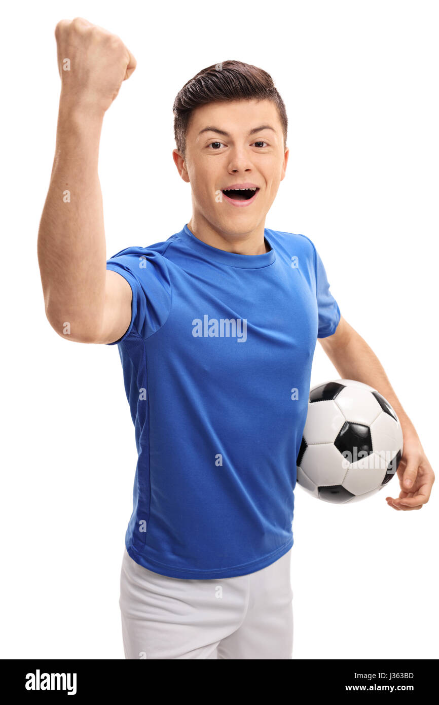 Teen football player looking at the camera and gesturing happiness