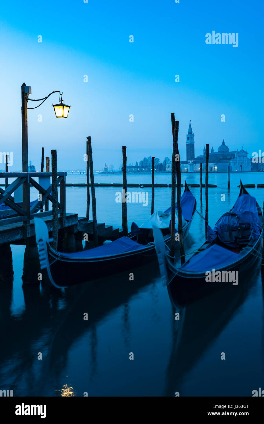 Dawn view of gondolas moored in Venice , Italy Stock Photo - Alamy