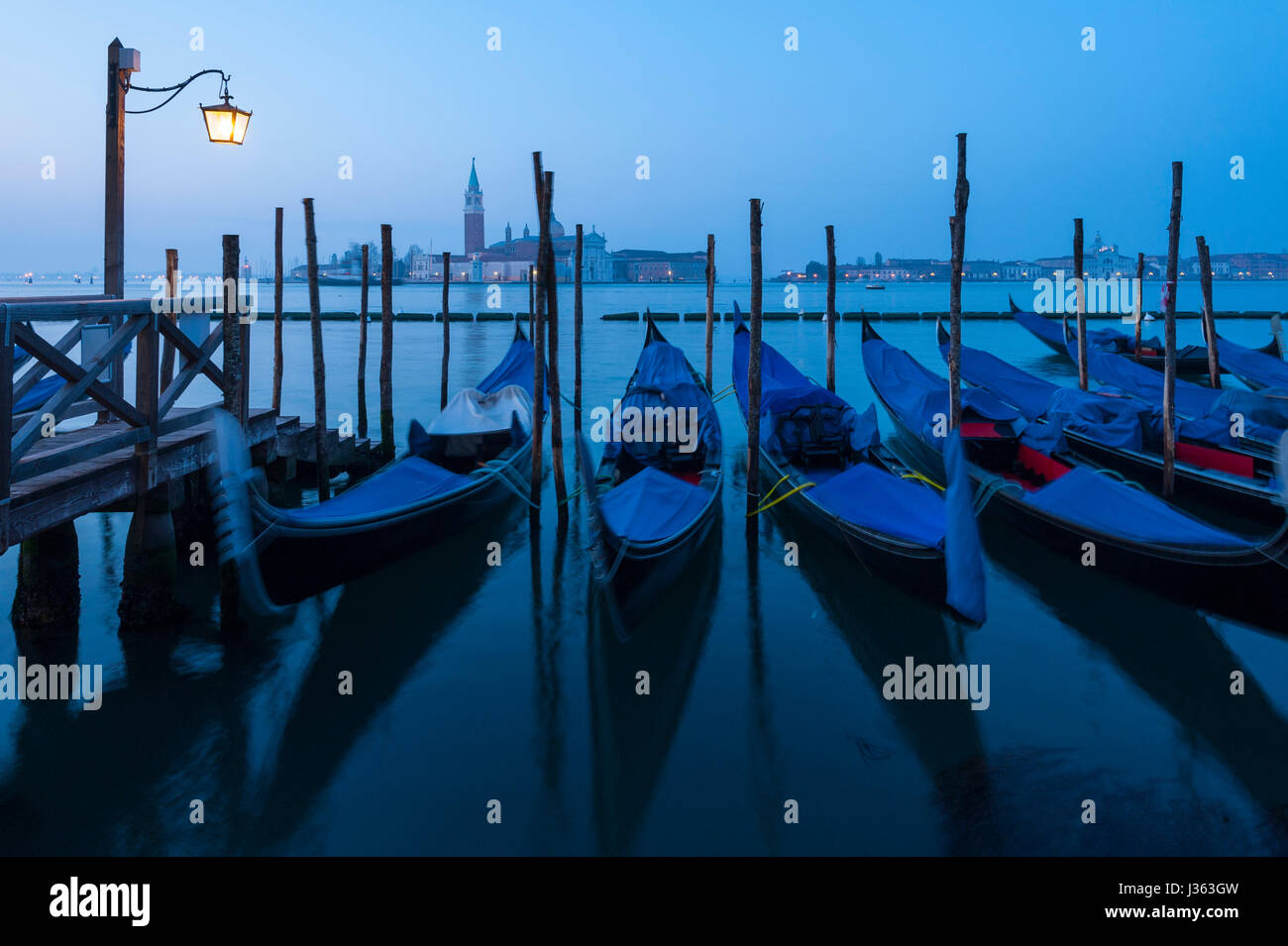 Dawn view of gondolas moored in Venice , Italy Stock Photo