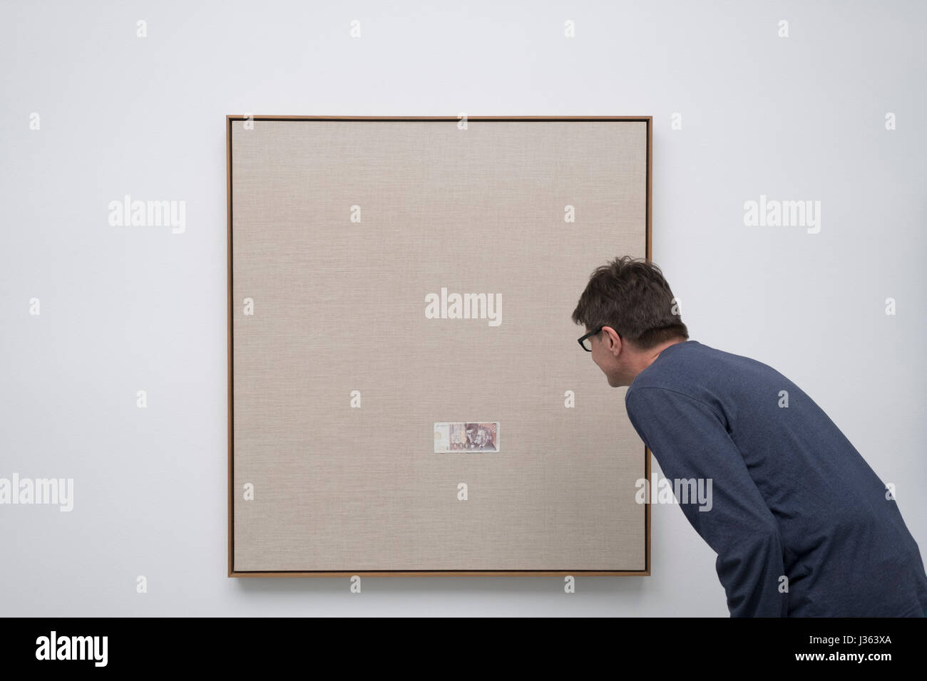Man looking at painting by Sergej Jensen at Kunsthalle in Baden-Baden,  Baden-Wurttemberg, Germany. Stock Photo