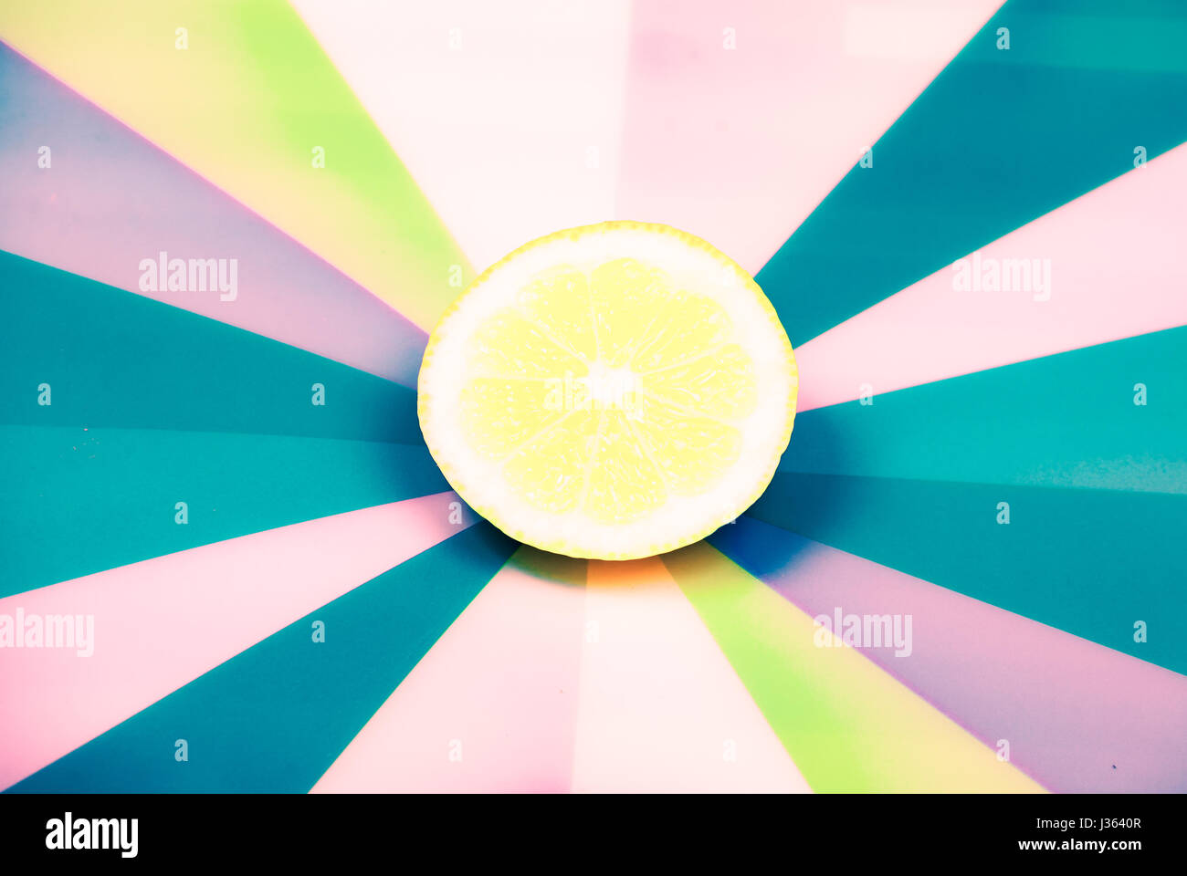 cut lemon on colorful background Stock Photo - Alamy