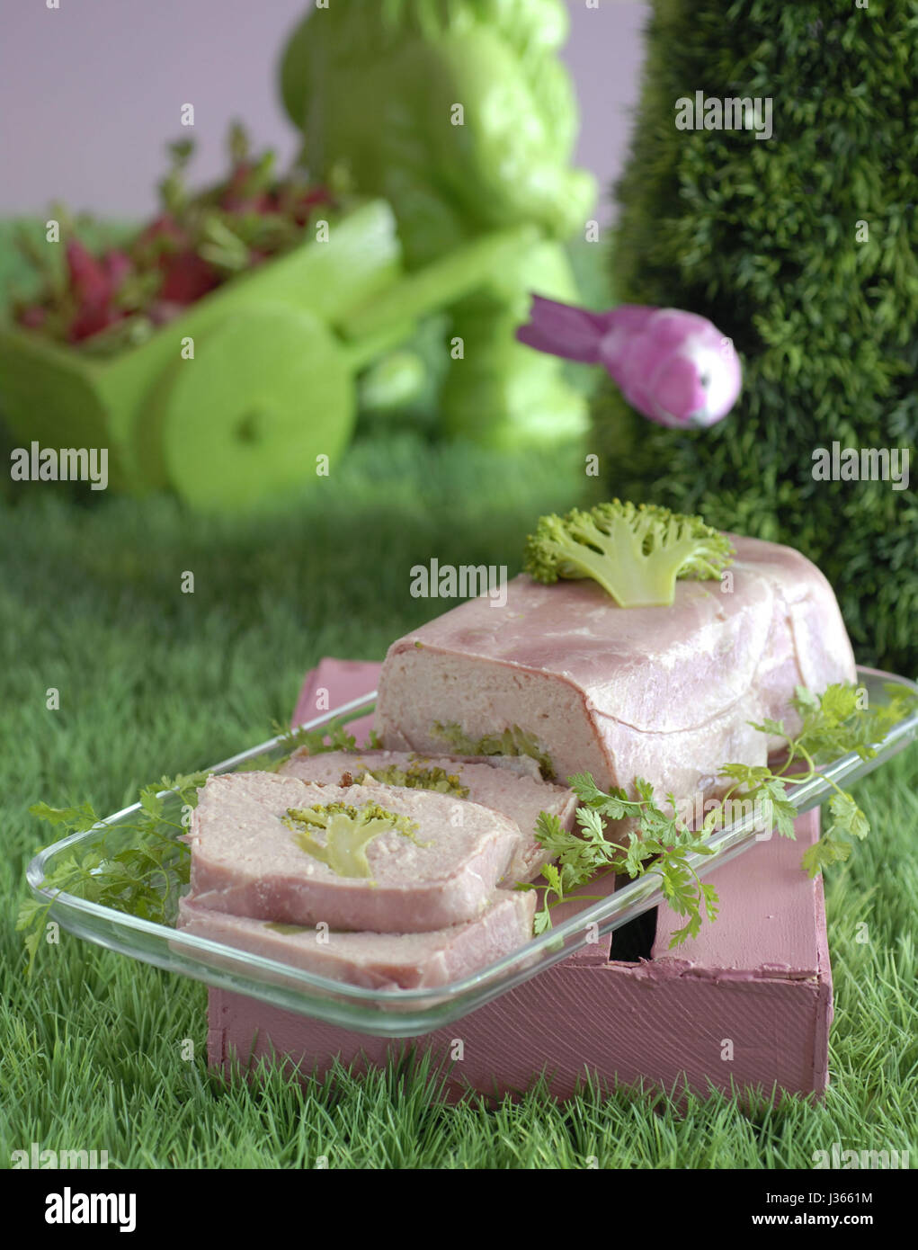 May, meal in pink and green theme: light broccoli ham terrine Stock Photo