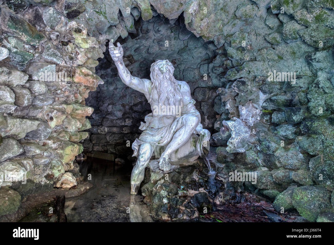 a statue of neptune in a cave Stock Photo