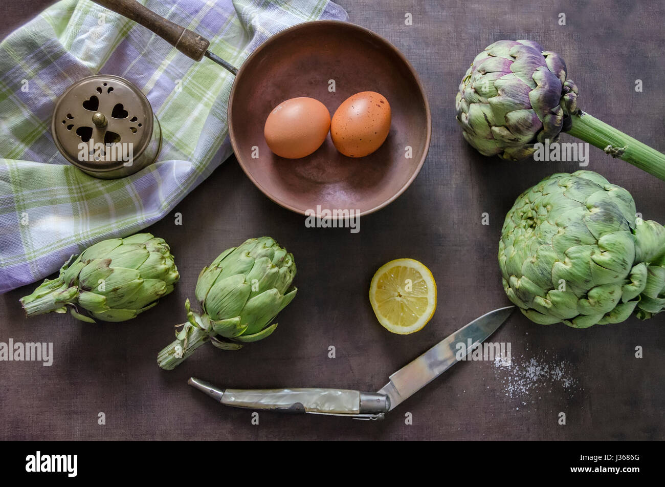 Artichokes, lemon and eggs Stock Photo