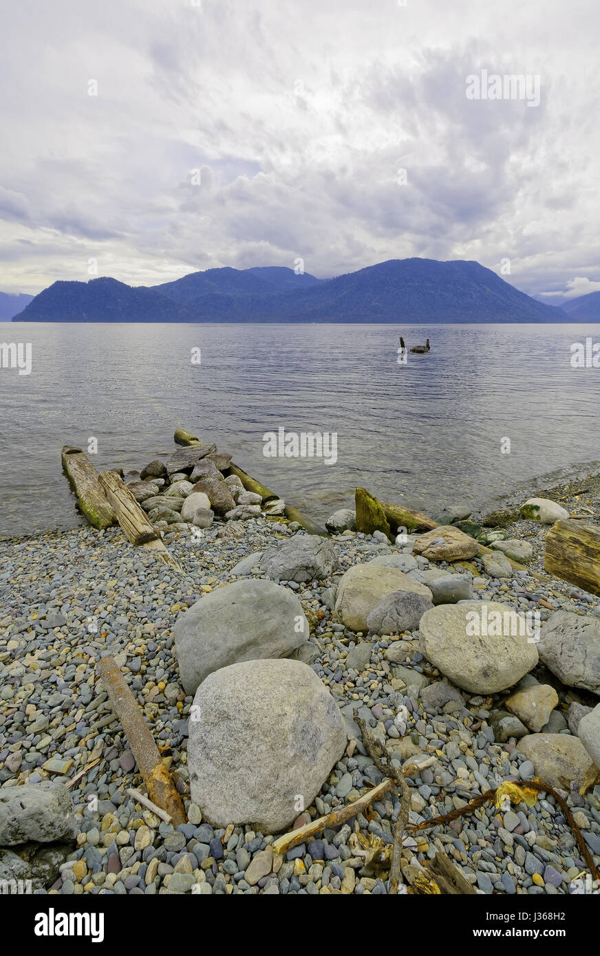 Siberia, summer. Teletskoye Lake old destroyed pier Stock Photo