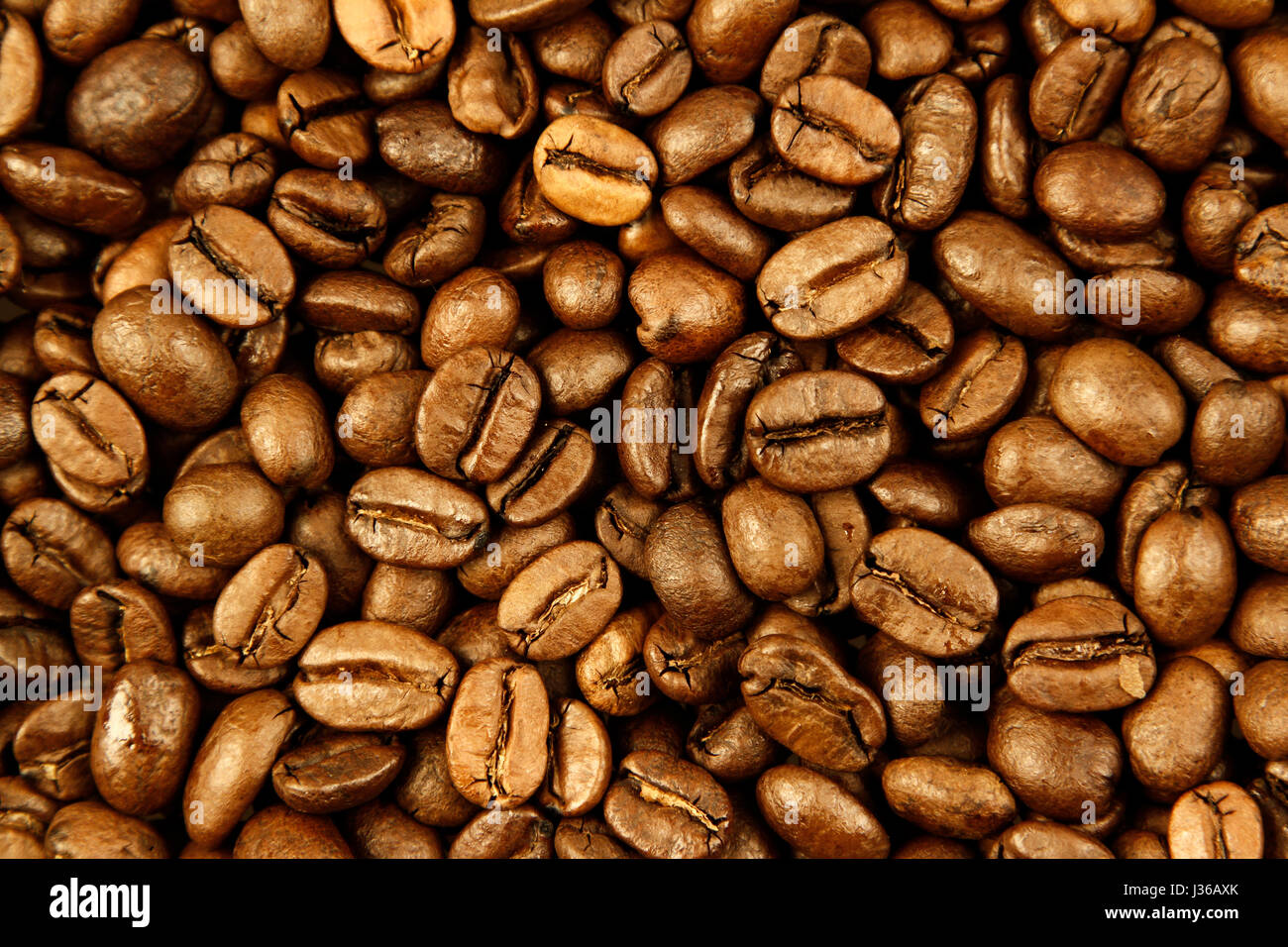 Closeup of roasted coffee beans Stock Photo - Alamy