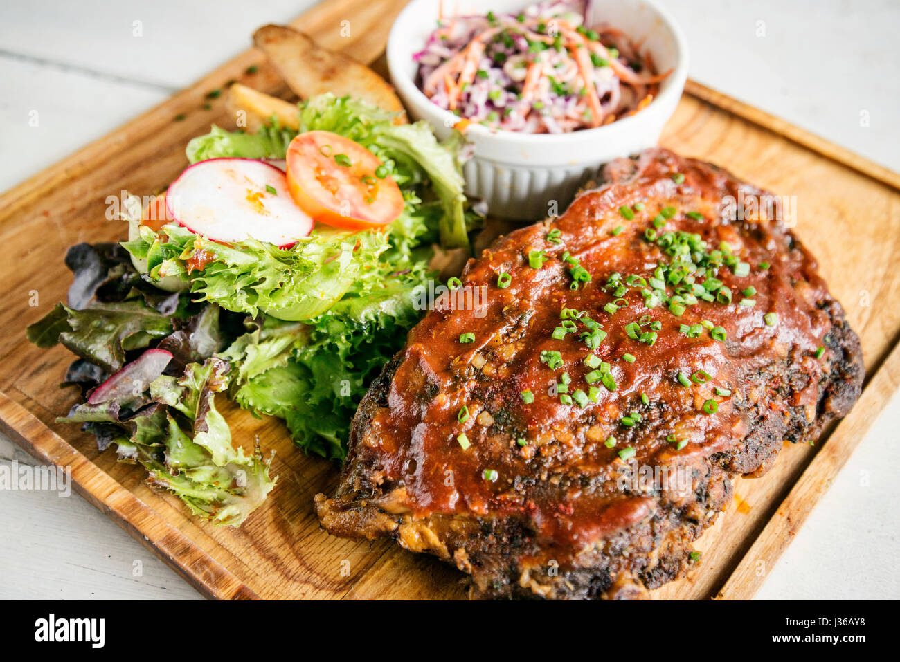 pork bbq ribs with  coleslaw and salad set meal Stock Photo