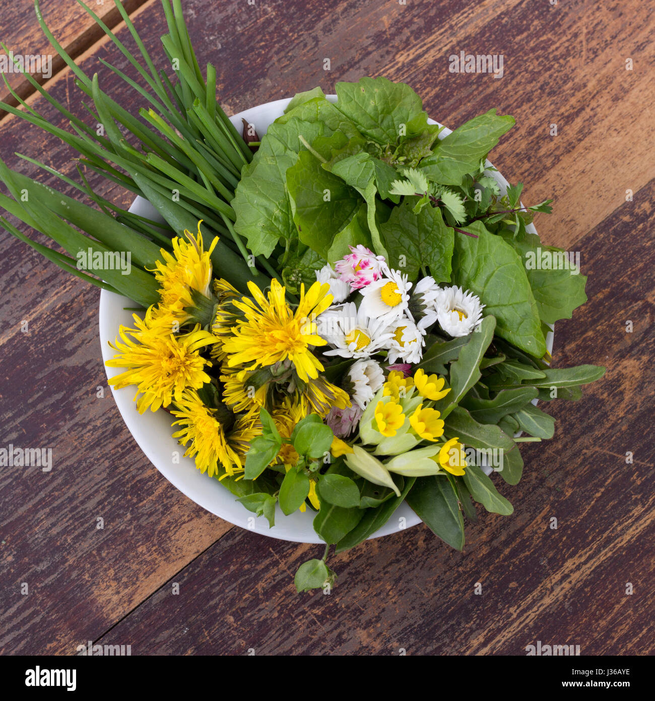 Bowl with various, fresh wild herbs Stock Photo