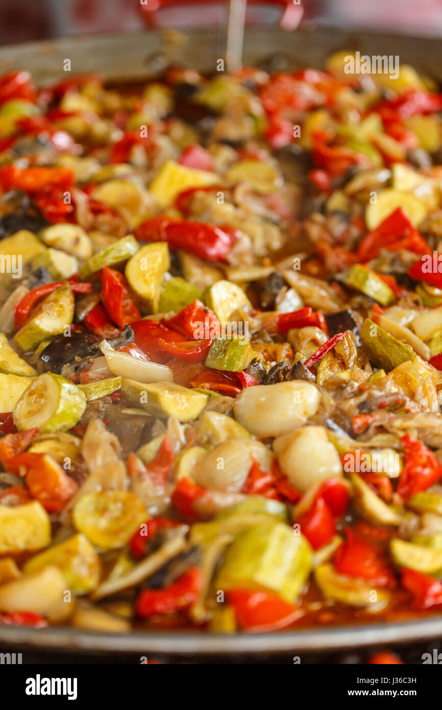 Mix of vegetables cooked in big metal wok Stock Photo