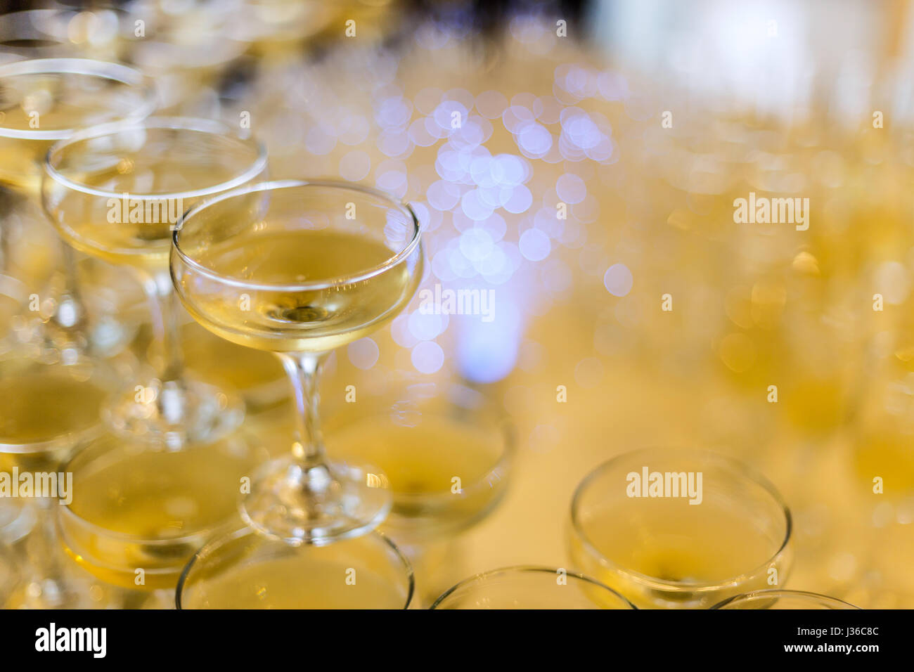 Champagne glasses pyramid on restaurant table Stock Photo