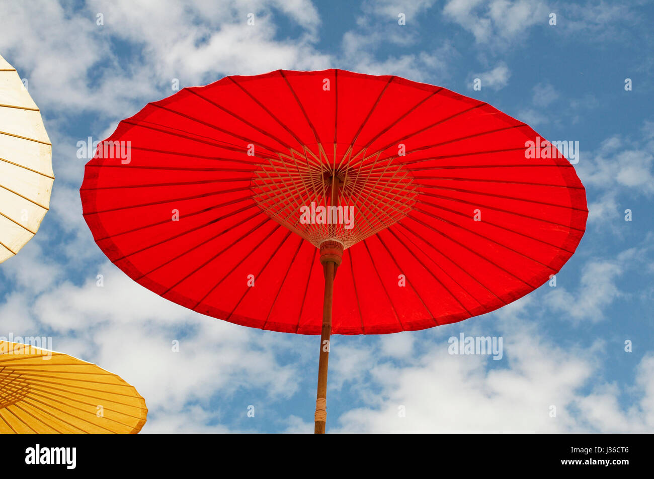 Colorful red sun umbrella Stock Photo