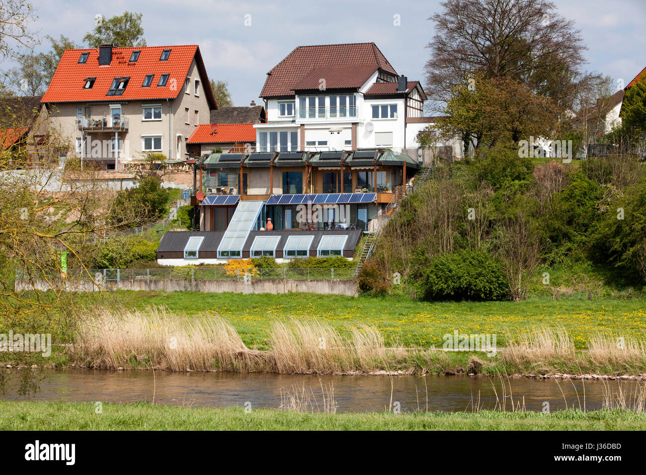 Rear of the houses on the banks of the River Weser, Bodenfelde, district of Northeim, Lower Saxony, Germany Stock Photo