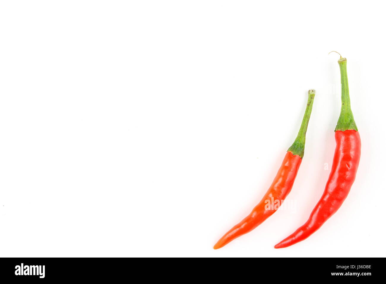 fresh thai chili peppers isolated on a white background as a food background texture Stock Photo