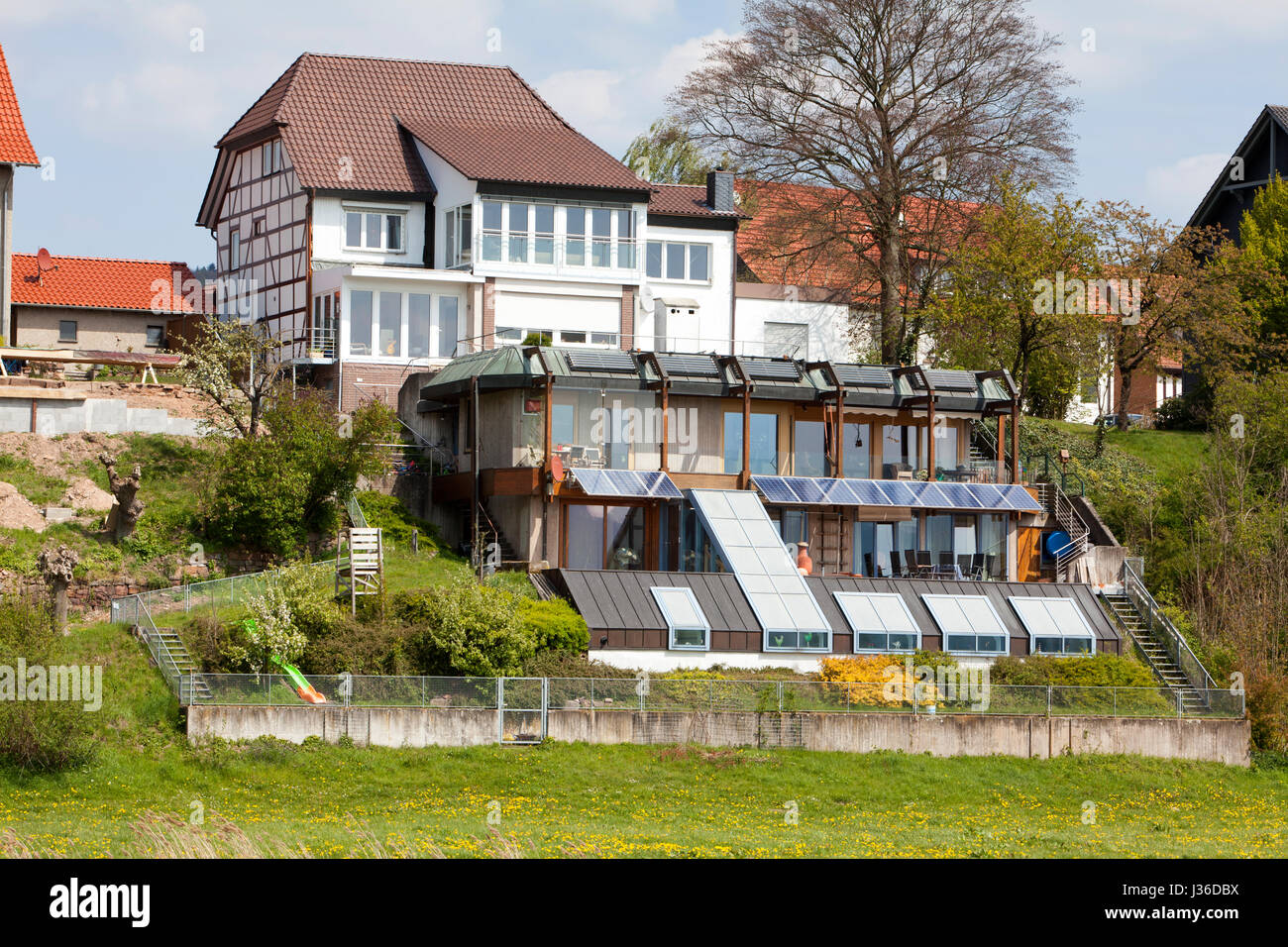 Rear of the houses on the banks of the River Weser, Bodenfelde, district of Northeim, Lower Saxony, Germany Stock Photo