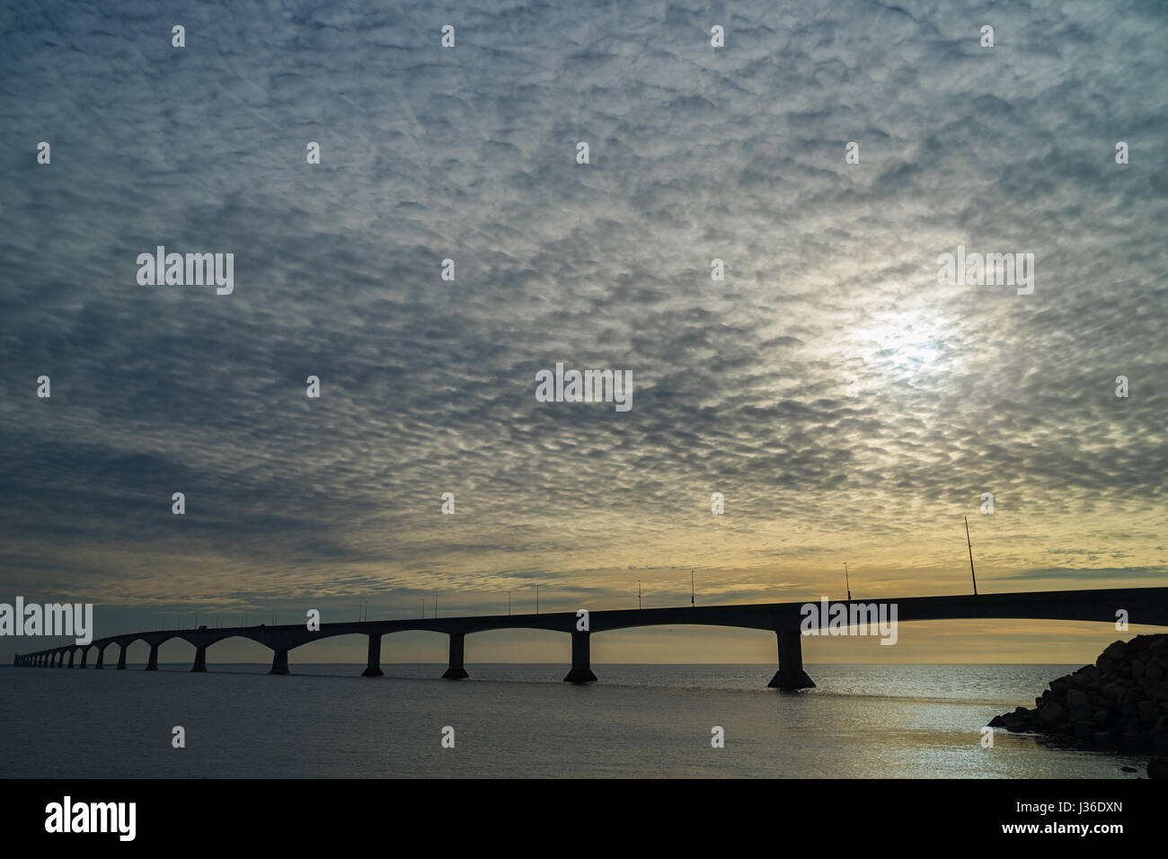 Cloudy skies over the Confederation Bridge linking Prince Edward Island with mainland New Brunswick, Canada. Stock Photo