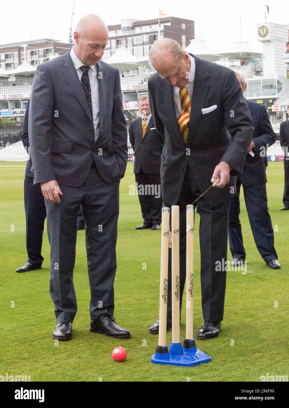The Duke of Edinburgh is shown self retracting bails by Marylebone Cricket Club's Laws of Cricket Manager Fraser Stewart (right) at Lord's Cricket Ground in London. Stock Photo