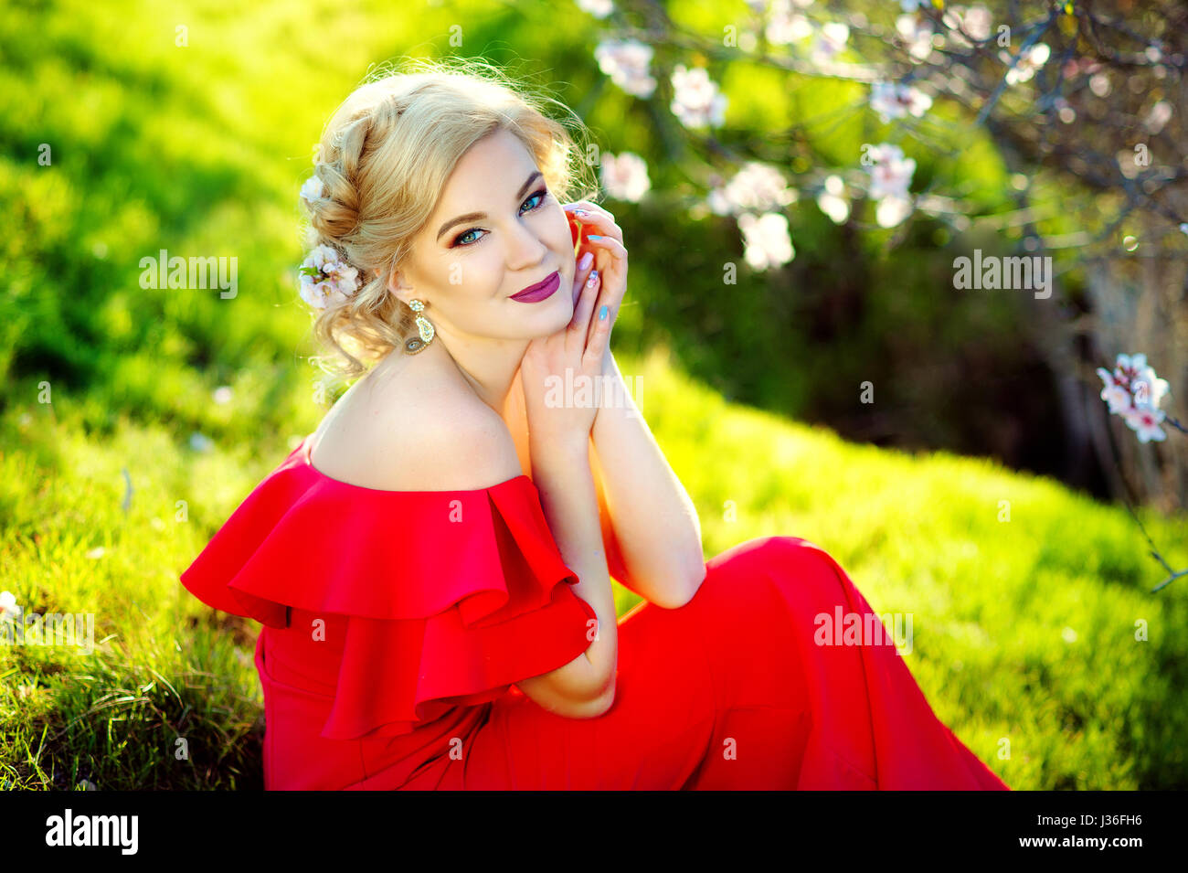 Beautiful Woman Fashion Model with Spring Blossoms Background. Spring ...