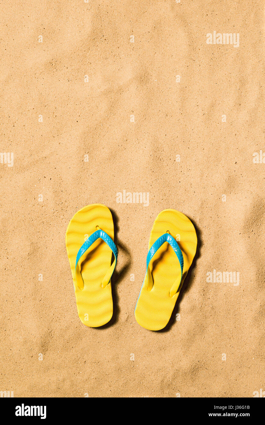Summer vacation background with a pair of flip flop sandals. Stock Photo
