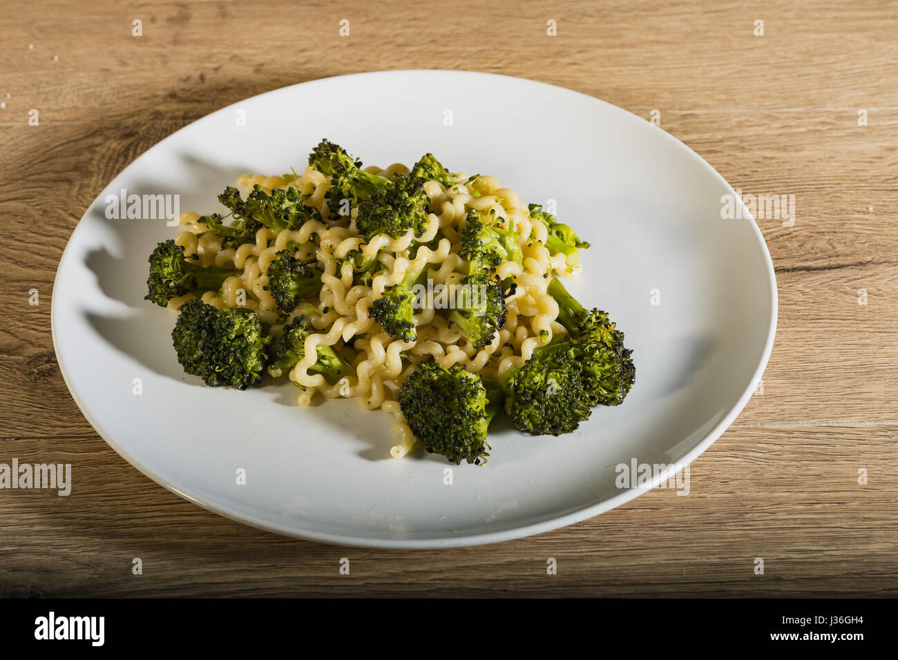 Long dough plate with broccoli from above Stock Photo