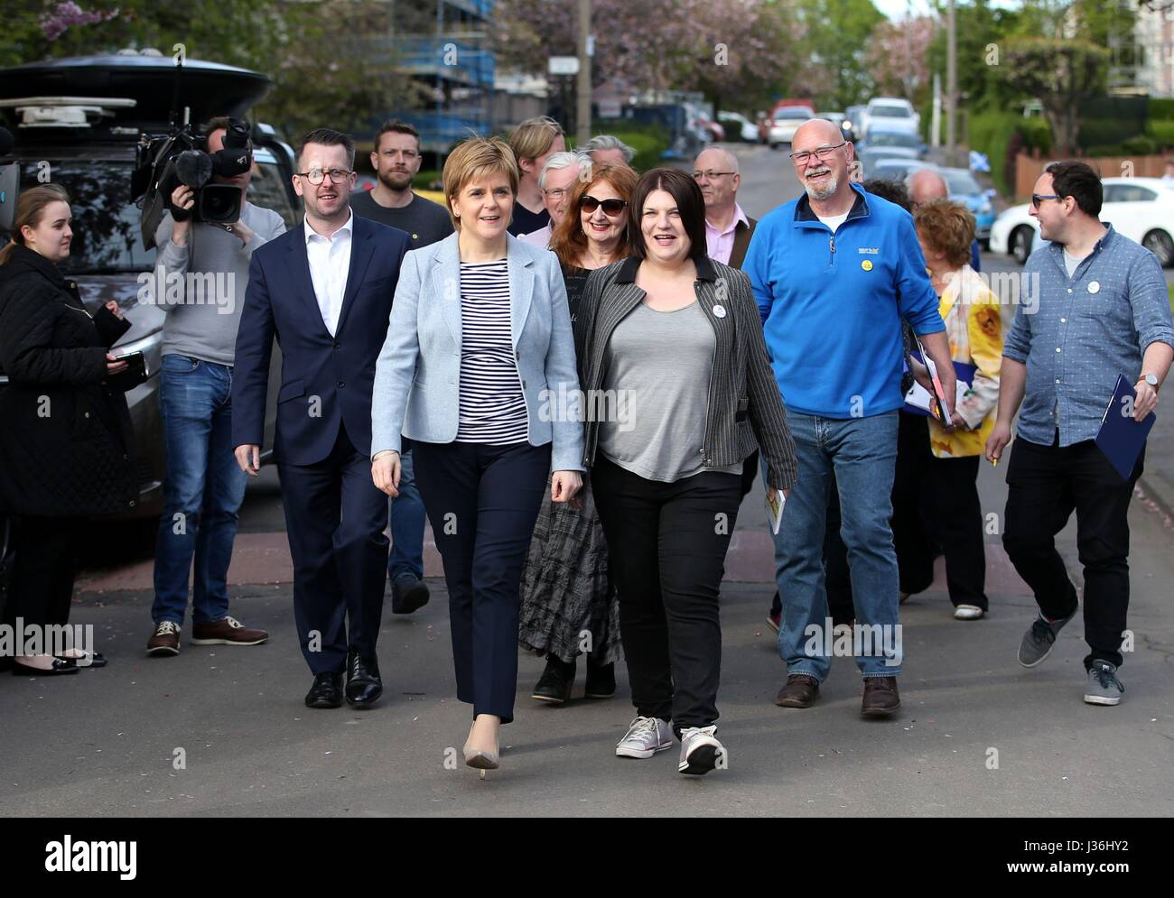 First Minister and SNP leader Nicola Sturgeon with SNP Glasgow Group Leader Susan Aitken (centre right) as they campaign in Toryglen, Glasgow, ahead of council elections on Thursday. Stock Photo