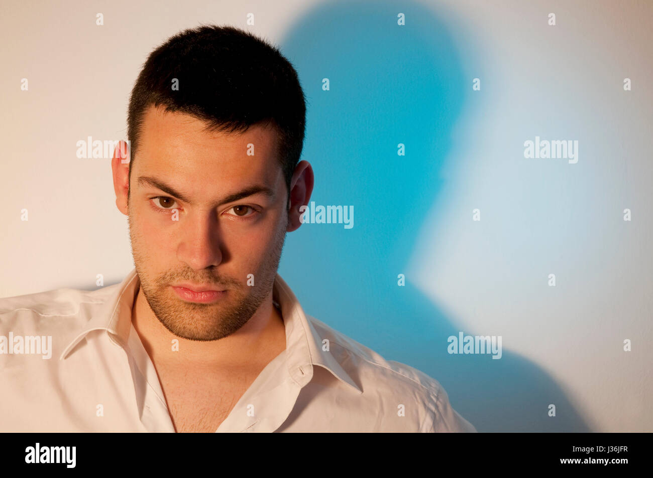 Young man looking at the camera Stock Photo - Alamy