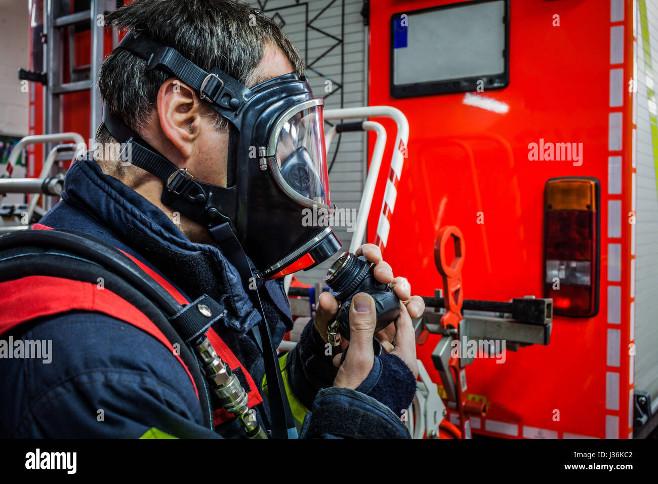 Firefighter in action with respiratory protection mask - HDR Stock Photo