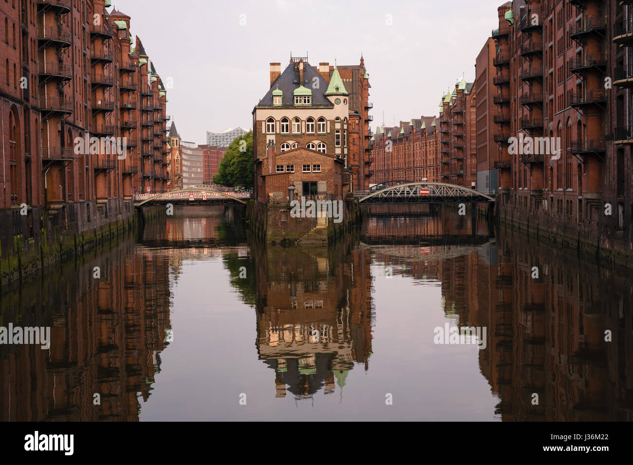 The famous Hamburg Wasserschloss, water castle, with the Wandrahmsfleet bridge in the Speicherstadt in Germany. Stock Photo