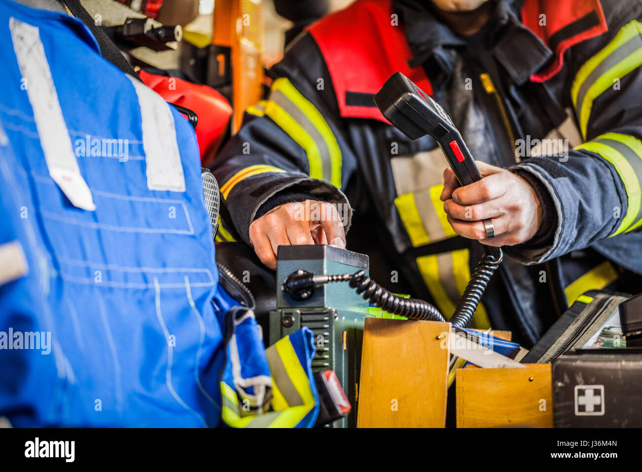 Firefighter used a radio set in a fire engine Stock Photo