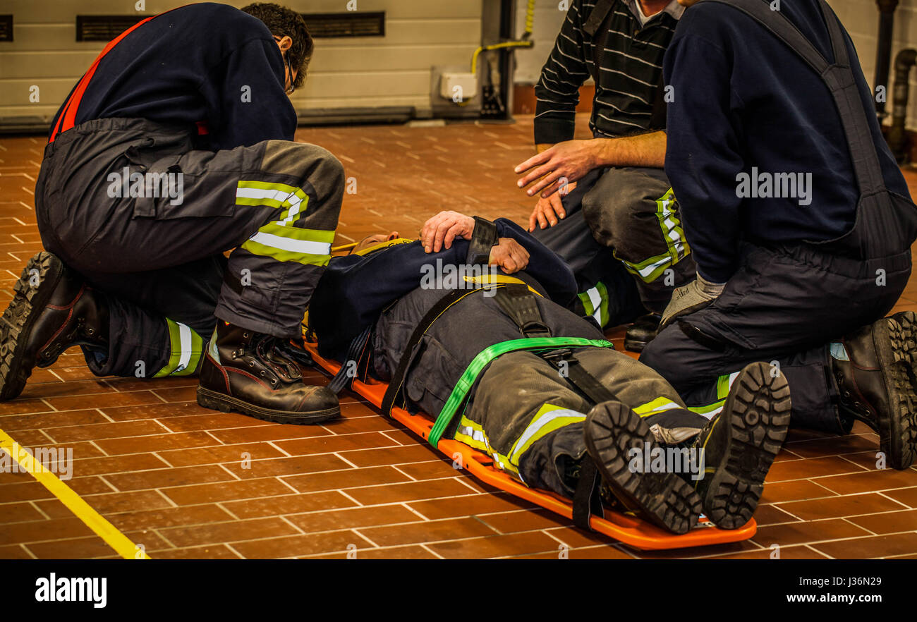 Firefighter rescue man with the carrier Stock Photo