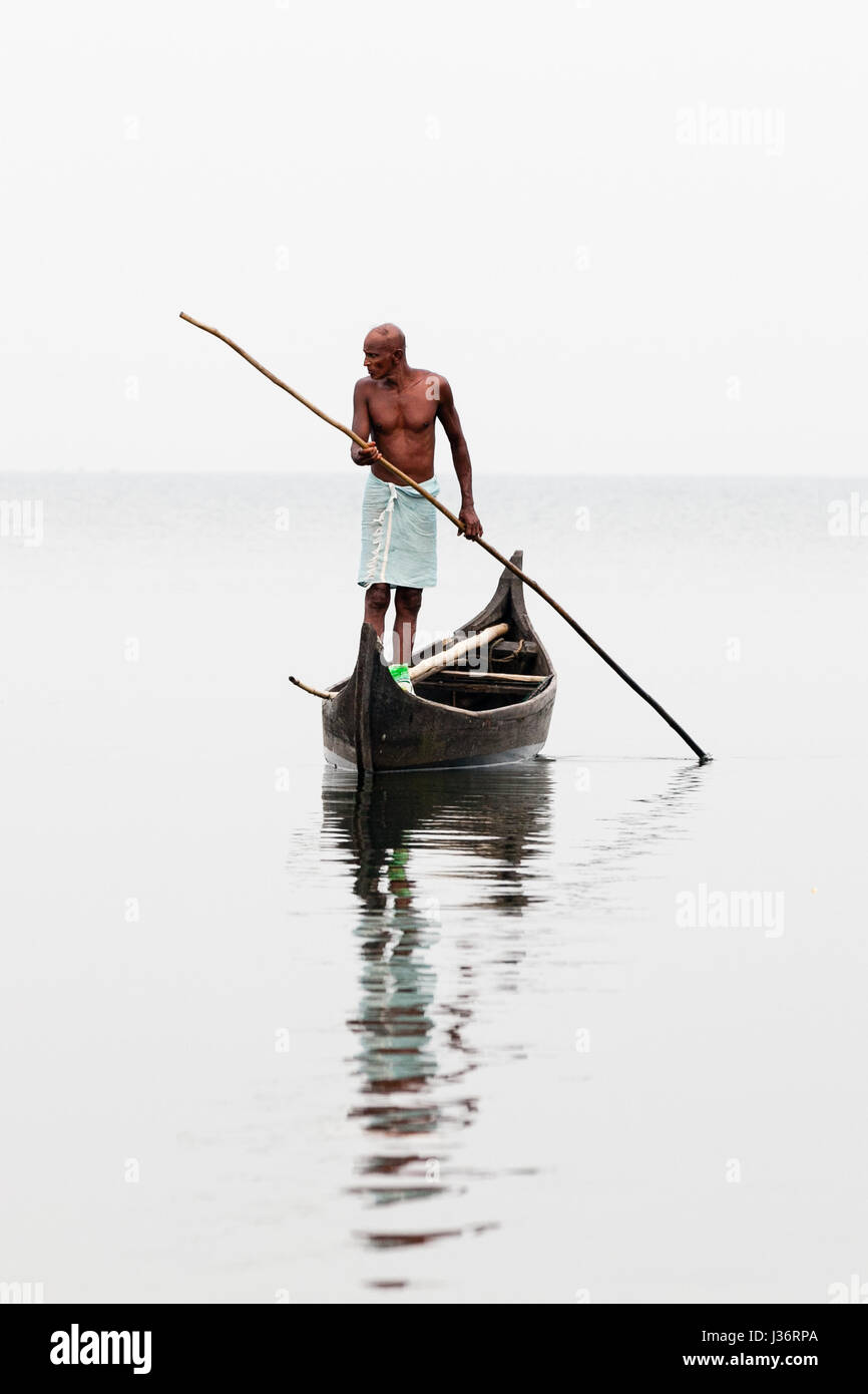 A local man fishing on the Keralan Backwaters Stock Photo