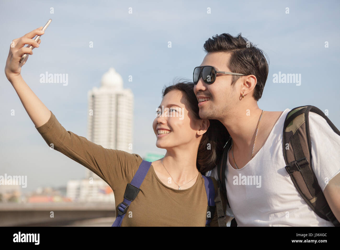 portrait of young man and woman selfie ,self portrait by mobile phone in relaxing emotion sea beach destination use for people in modern life style Stock Photo