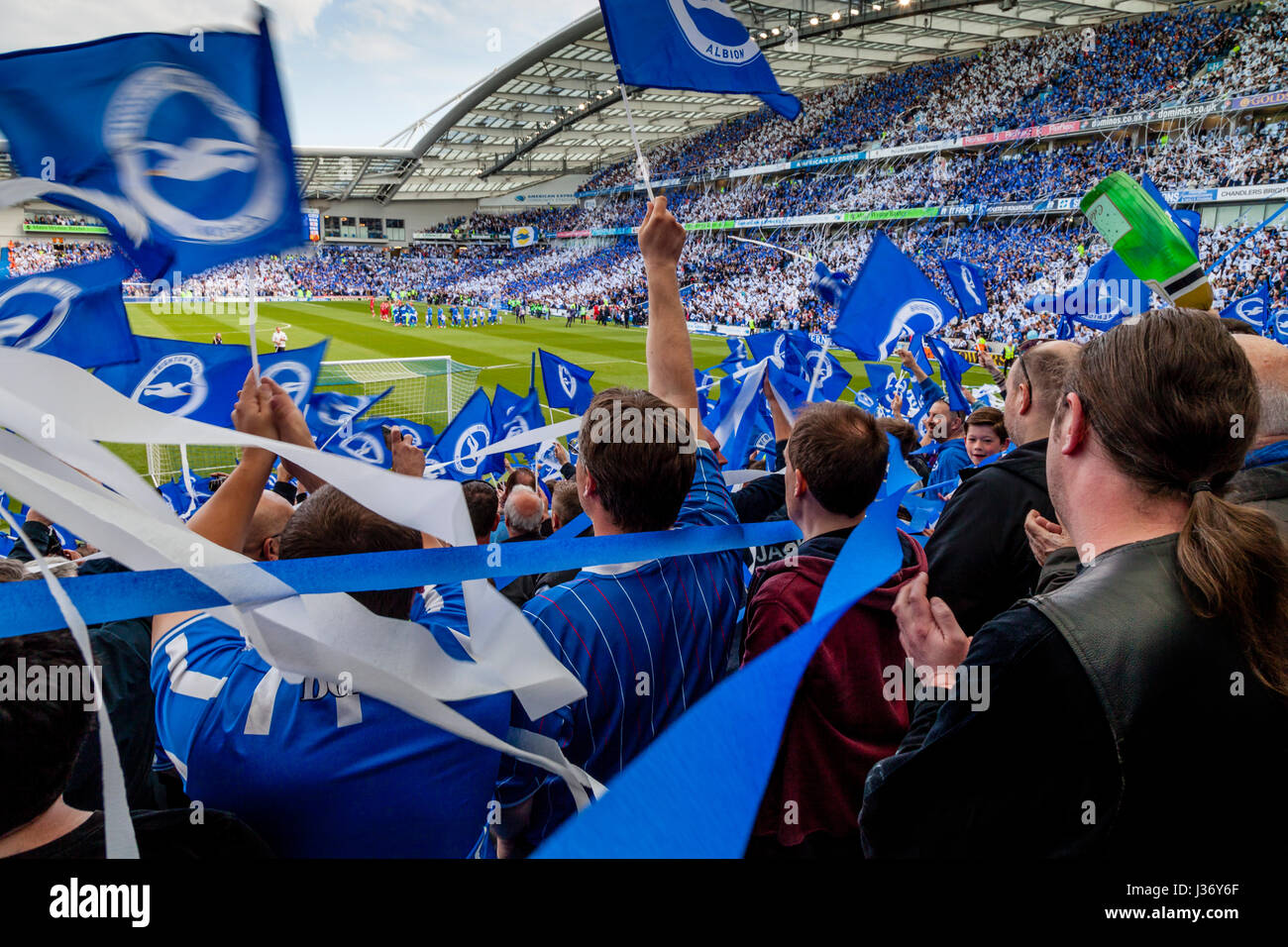 Brighton and Hove Albion Football Fans Cheer Their Team On To The Pitch For The Final Game Of The Season After Securing Promotion, Brighton, UK Stock Photo