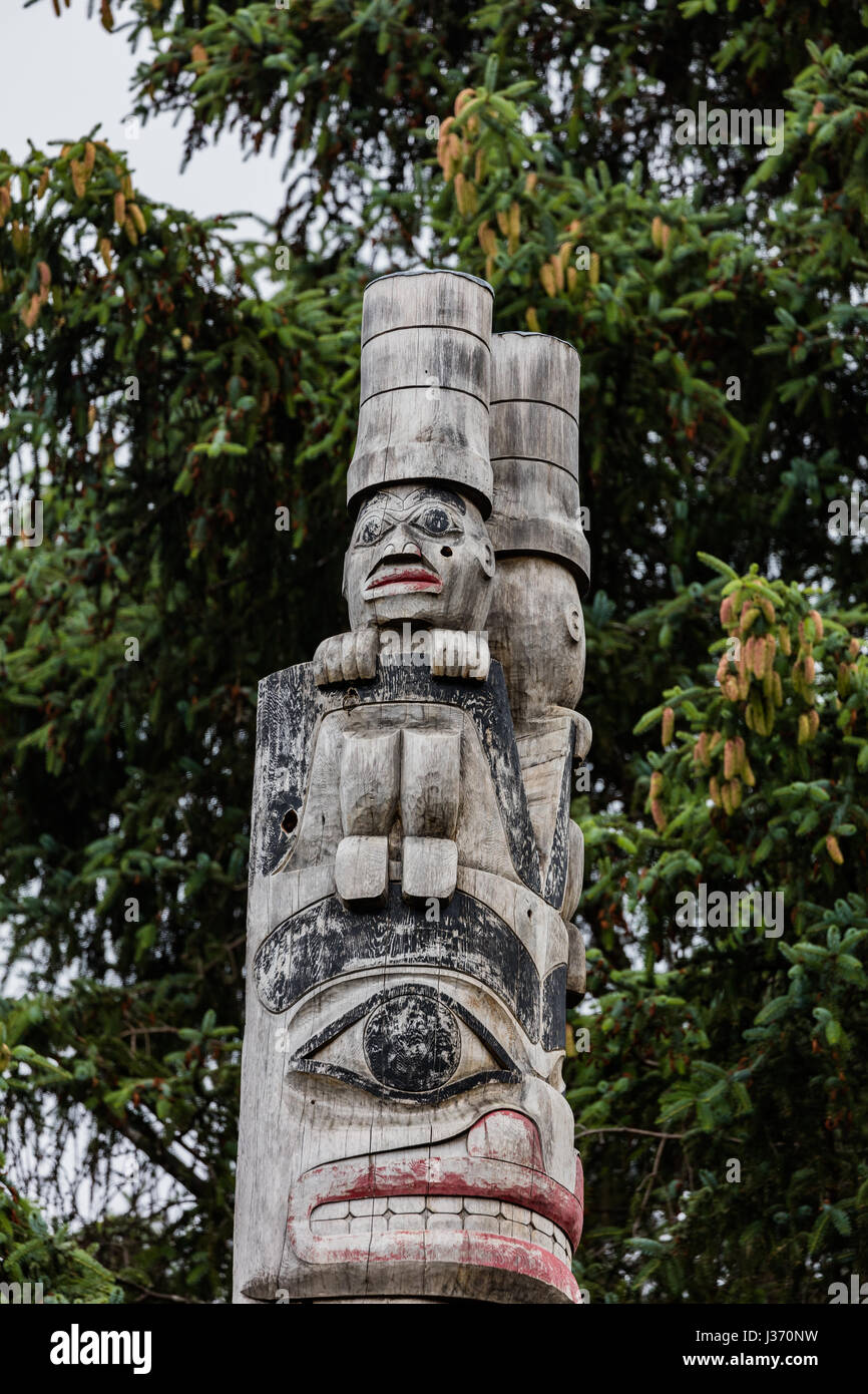 Totem poles in Alaska Stock Photo - Alamy