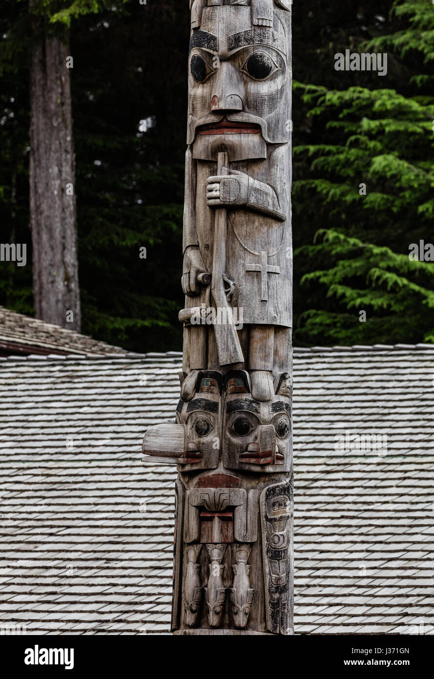 Totem poles in Alaska Stock Photo - Alamy