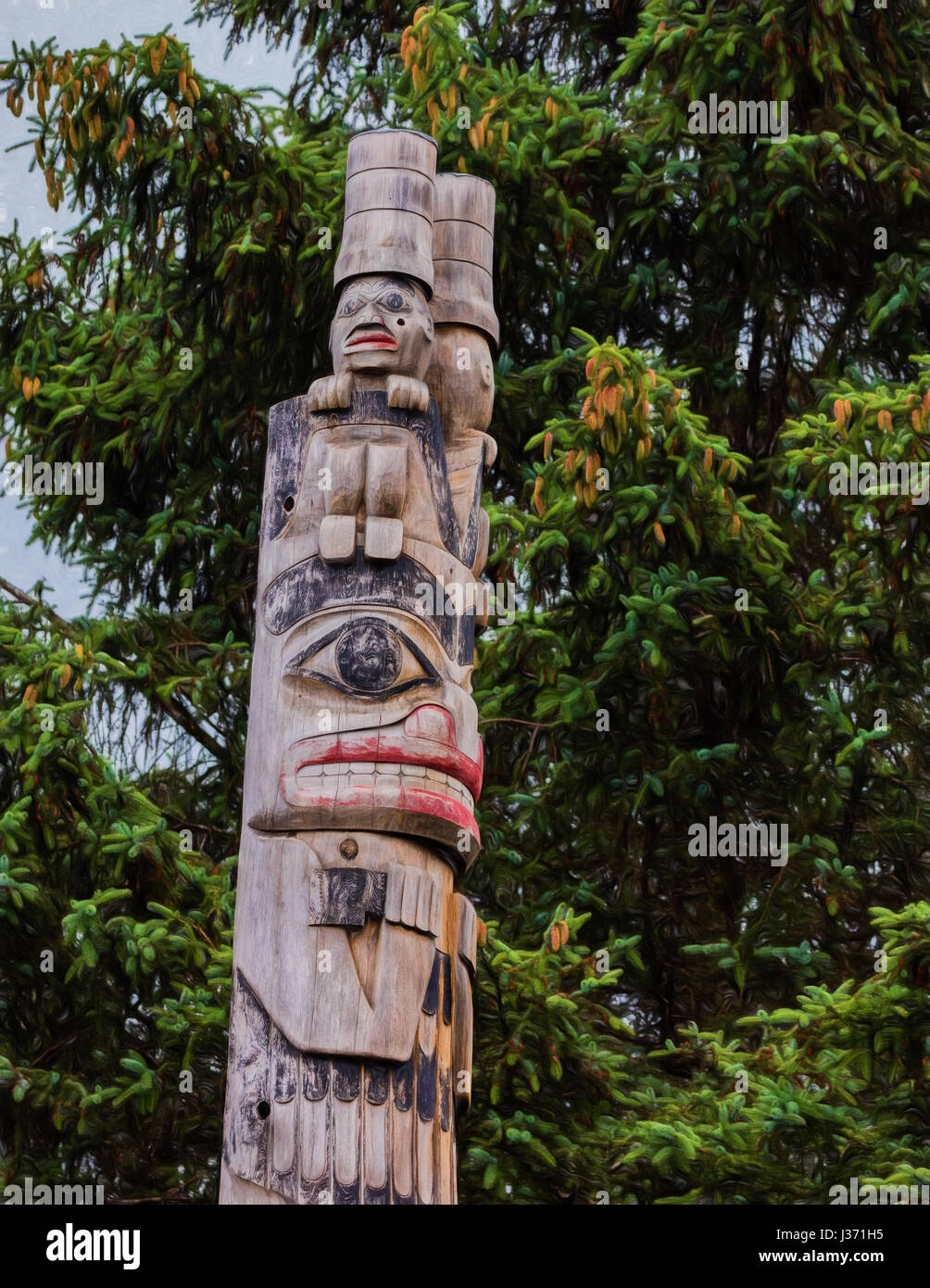 Totem poles in Alaska Stock Photo - Alamy