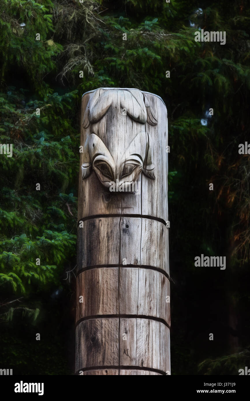 Native American Tlingit totem Poles in Sitka, Alaska. Stock Photo