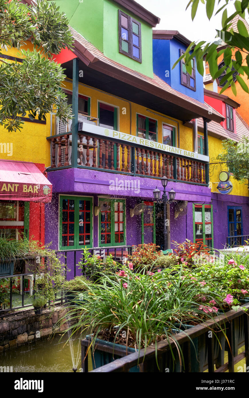 Pizza restaurant exterior. Brightly coloured building exterior. Stock Photo