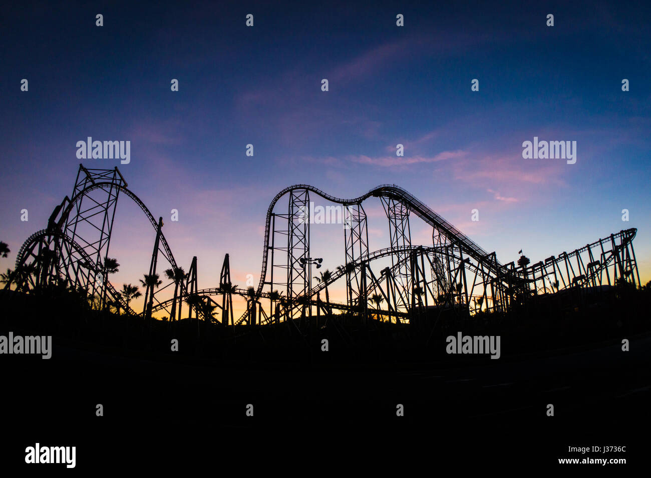 Rollercoaster silhouette during sunset at Six Flags Magic Mountain Stock Photo