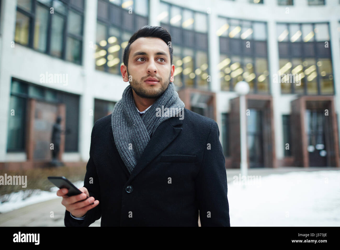 Stylish Middle-Eastern Businessman with Phone Stock Photo