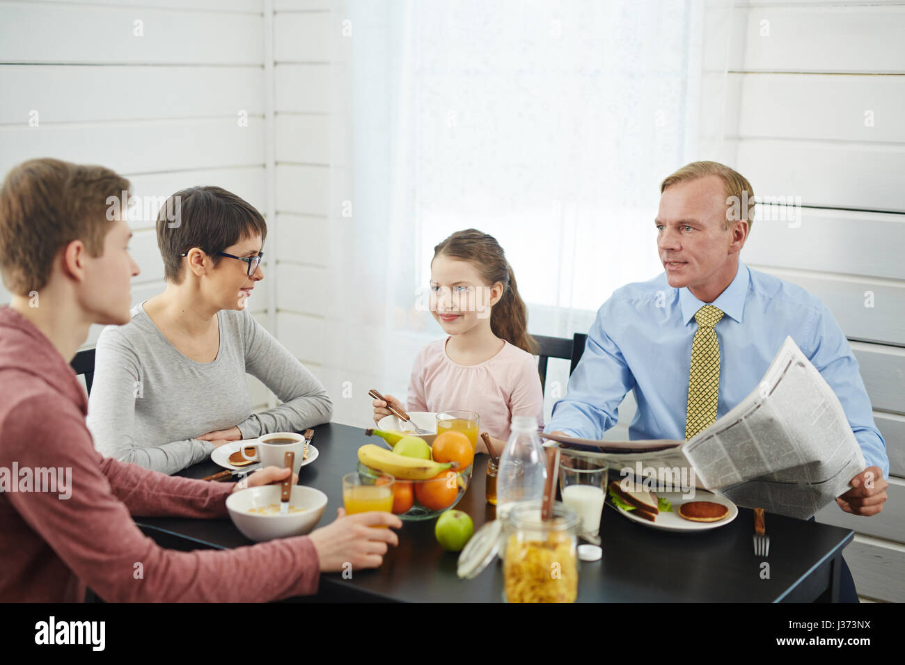 Lovely Family Enjoying Breakfast Stock Photo