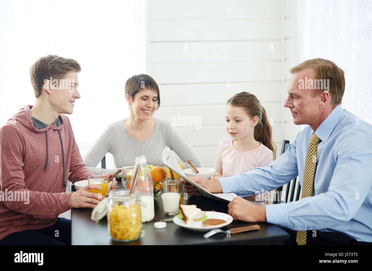 Newspaper Reading at Breakfast Stock Photo Alamy