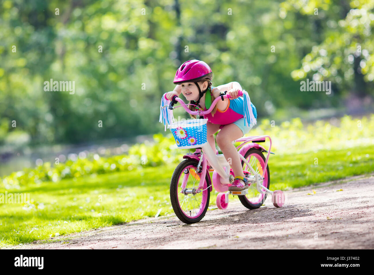 Little girl on bike hi res stock photography and images Alamy