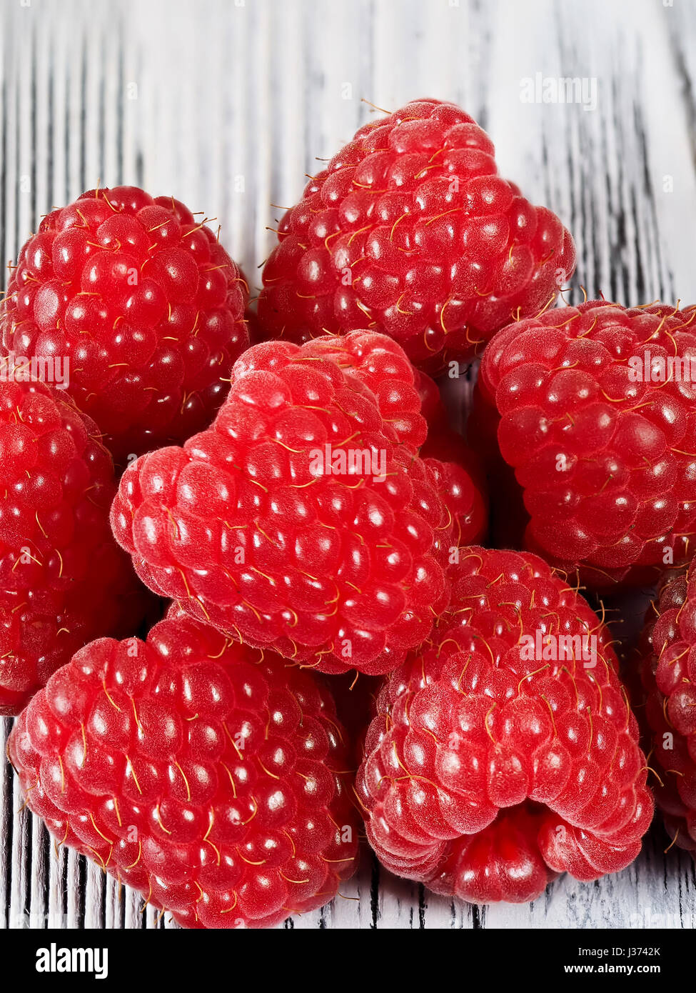 Fresh raspberry on the wooden background Stock Photo
