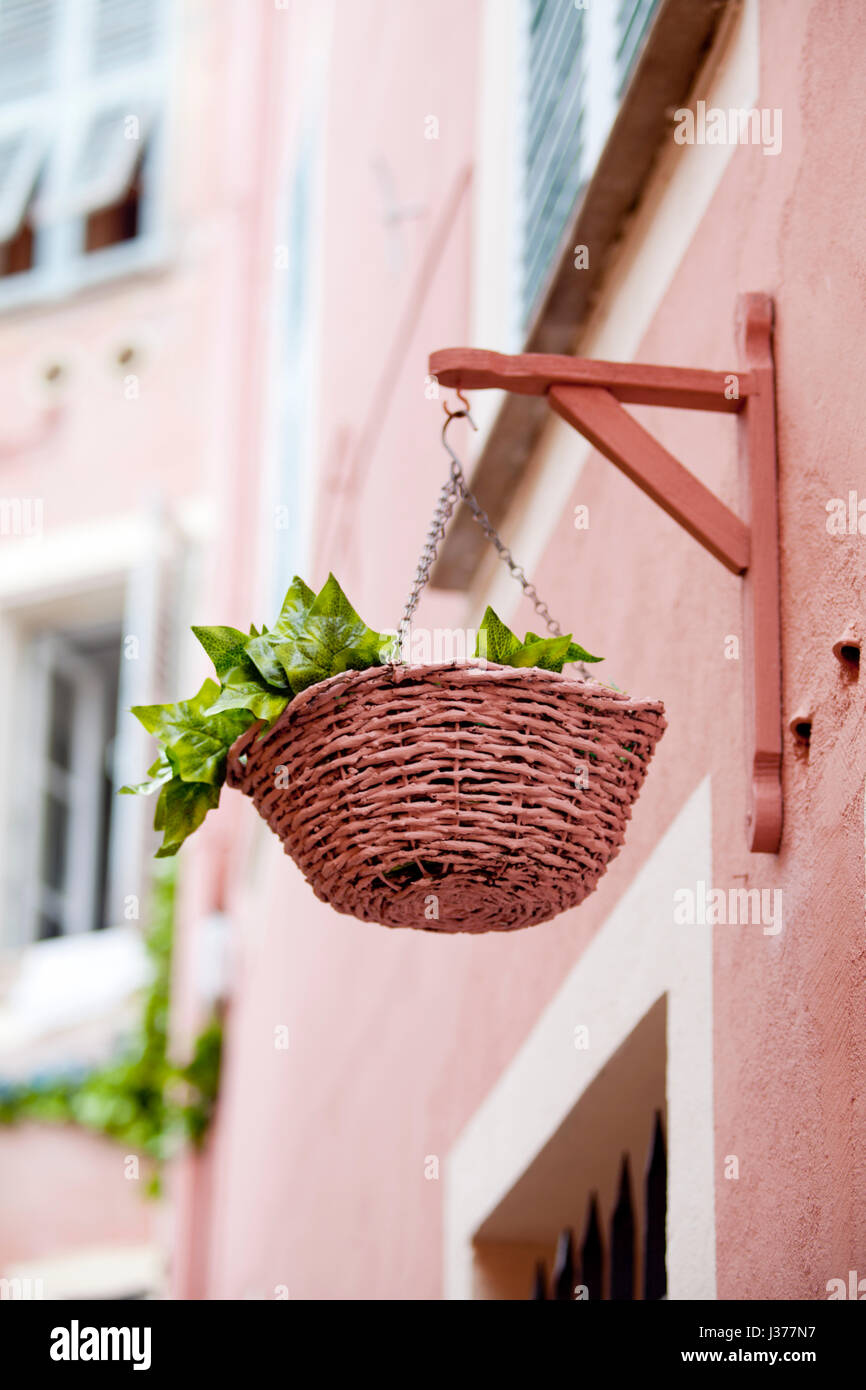 Flower basket hanging on the exterior wall Stock Photo Alamy