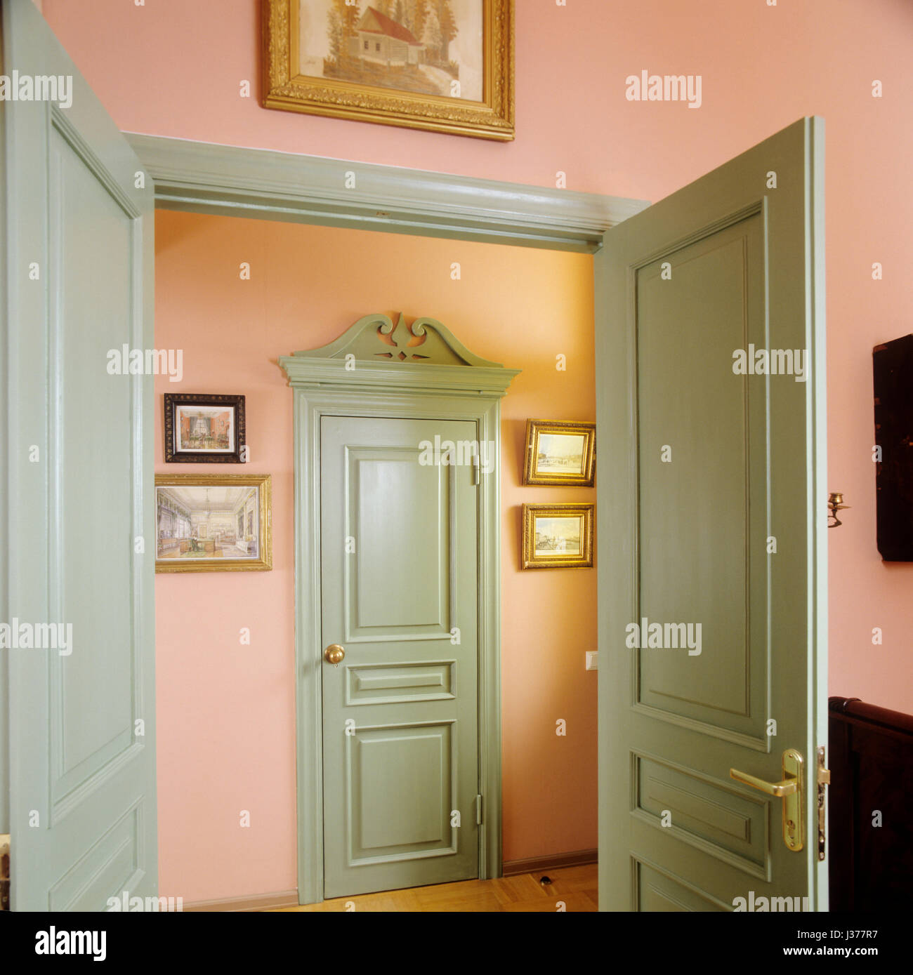 Doors leading to pastel hallway Stock Photo Alamy