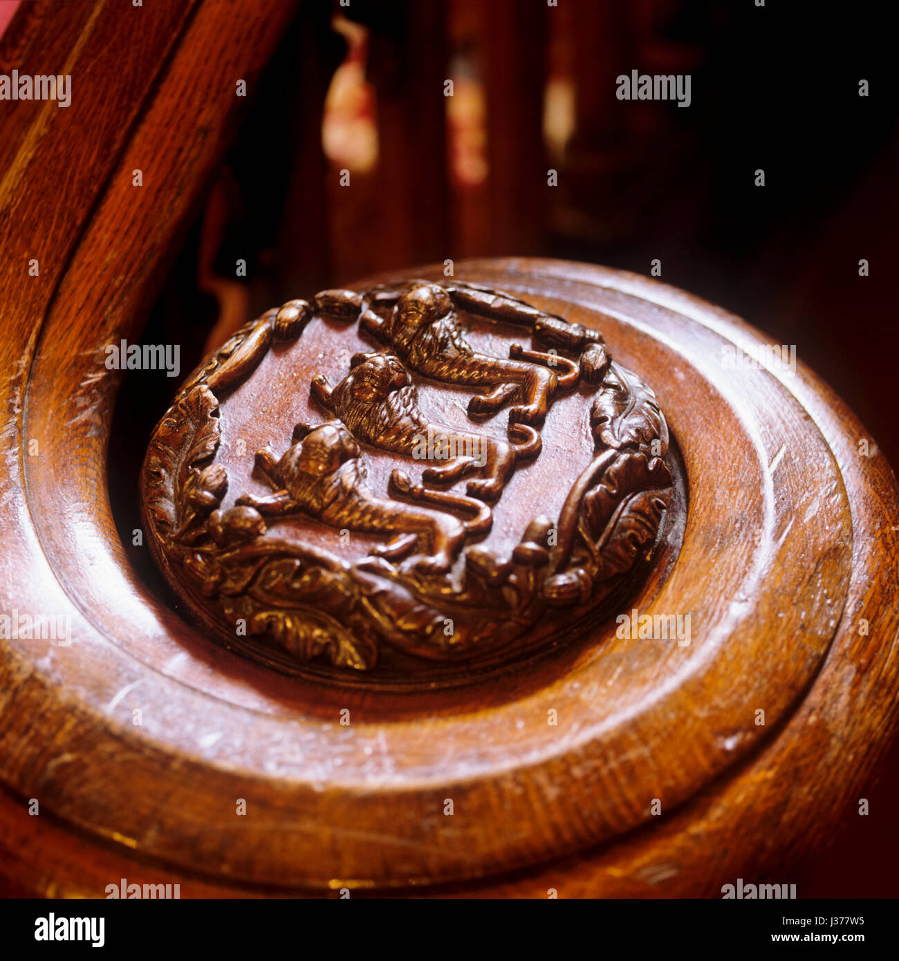 End of ornate wooden railing. Stock Photo